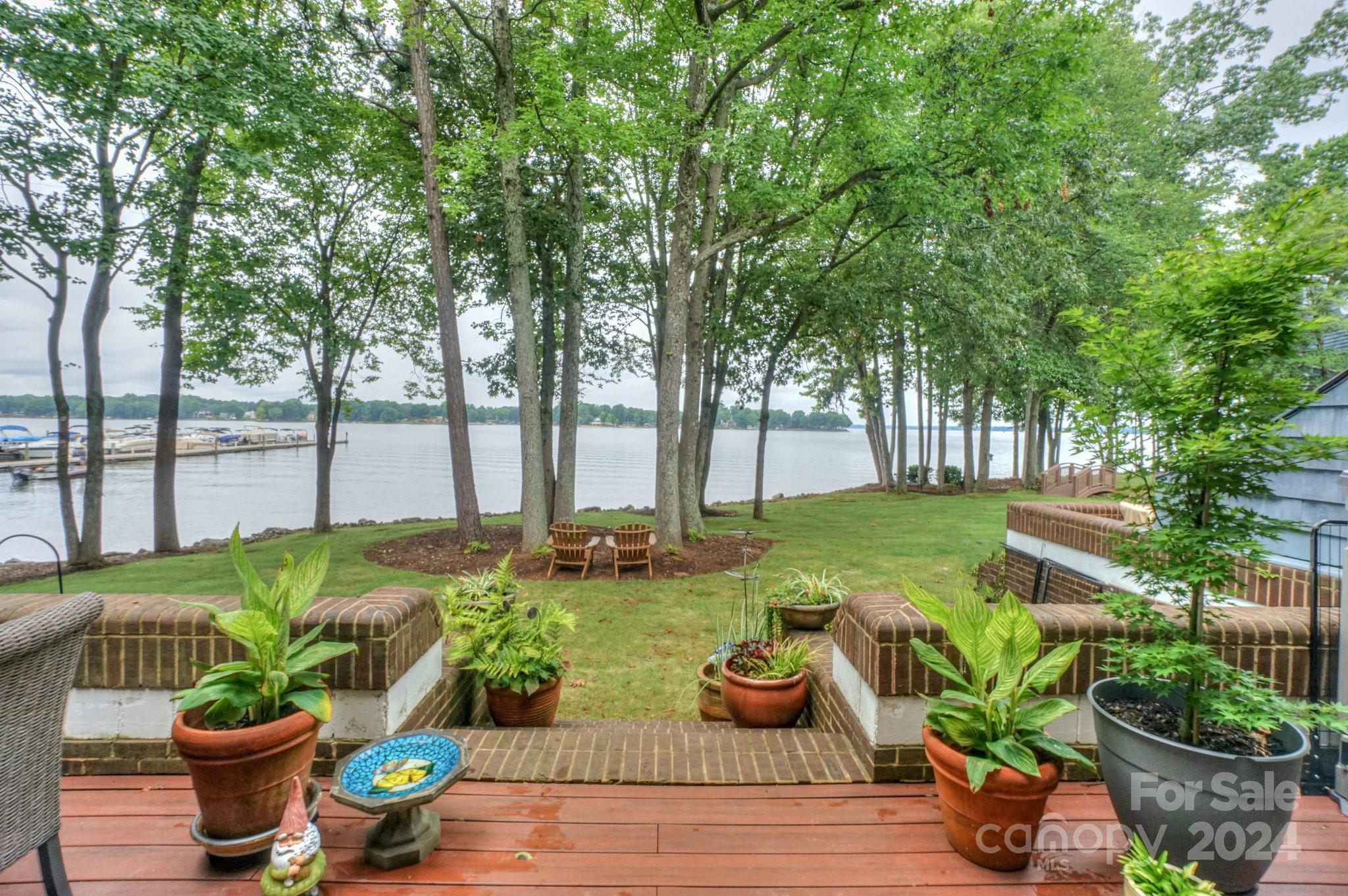 a view of a backyard with garden and patio