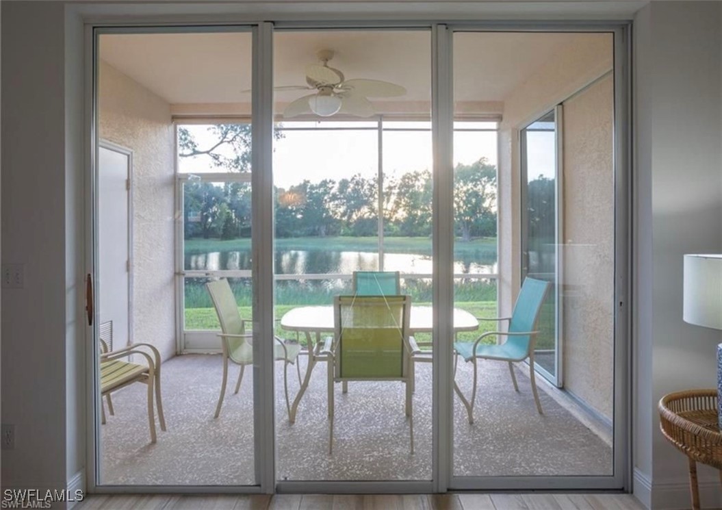 a view of a dining room with furniture and a window