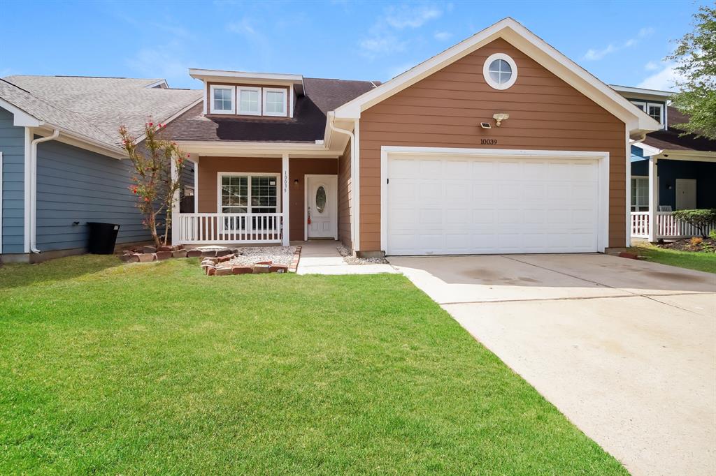 a front view of a house with a yard and porch