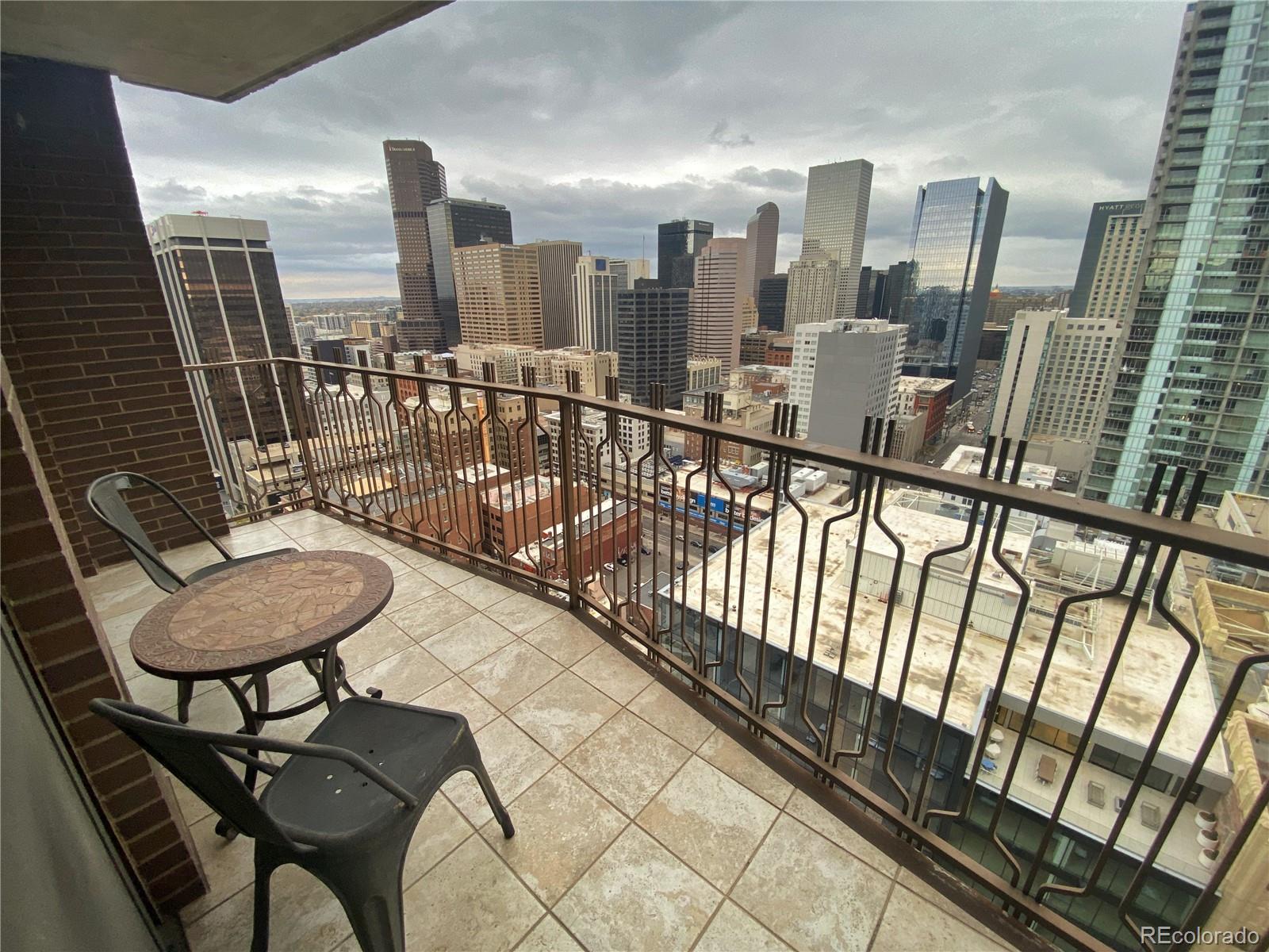 a view of a balcony with chairs