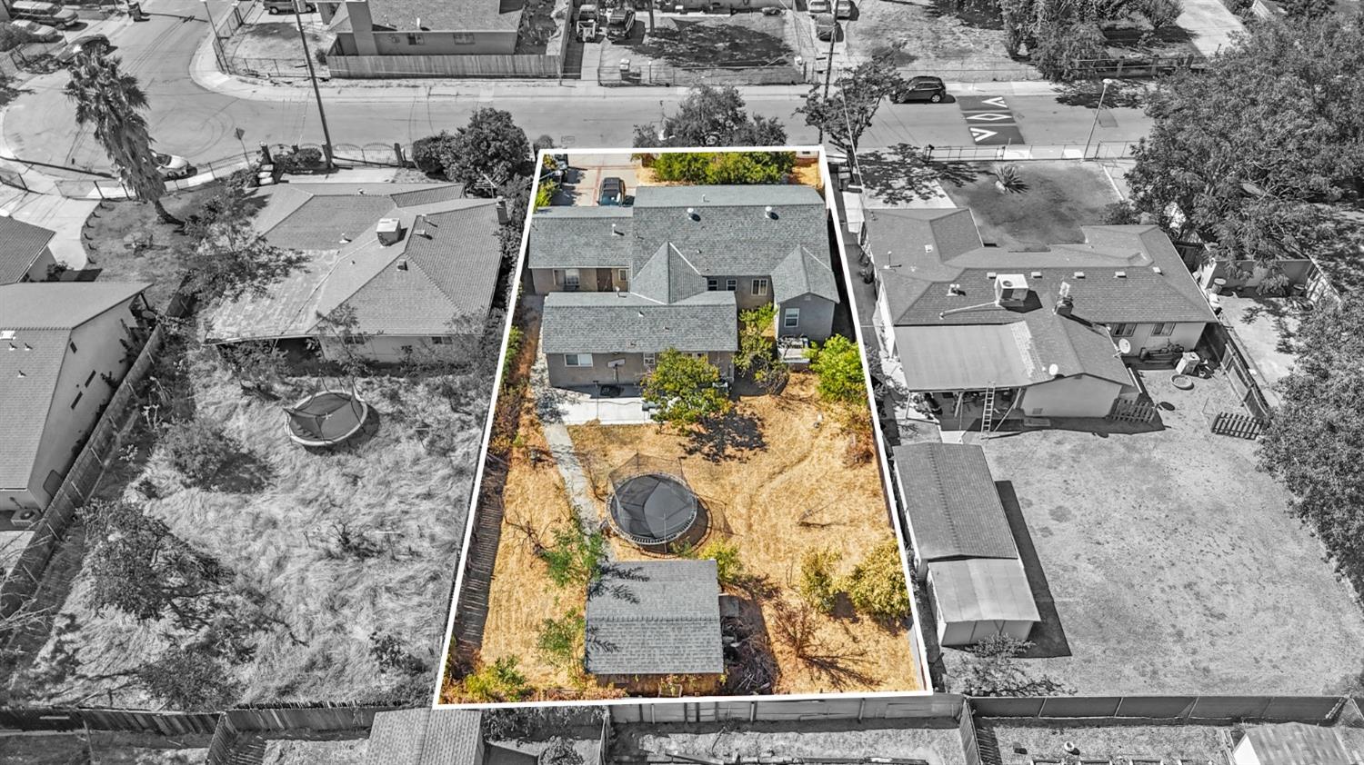 an aerial view of residential houses with outdoor space