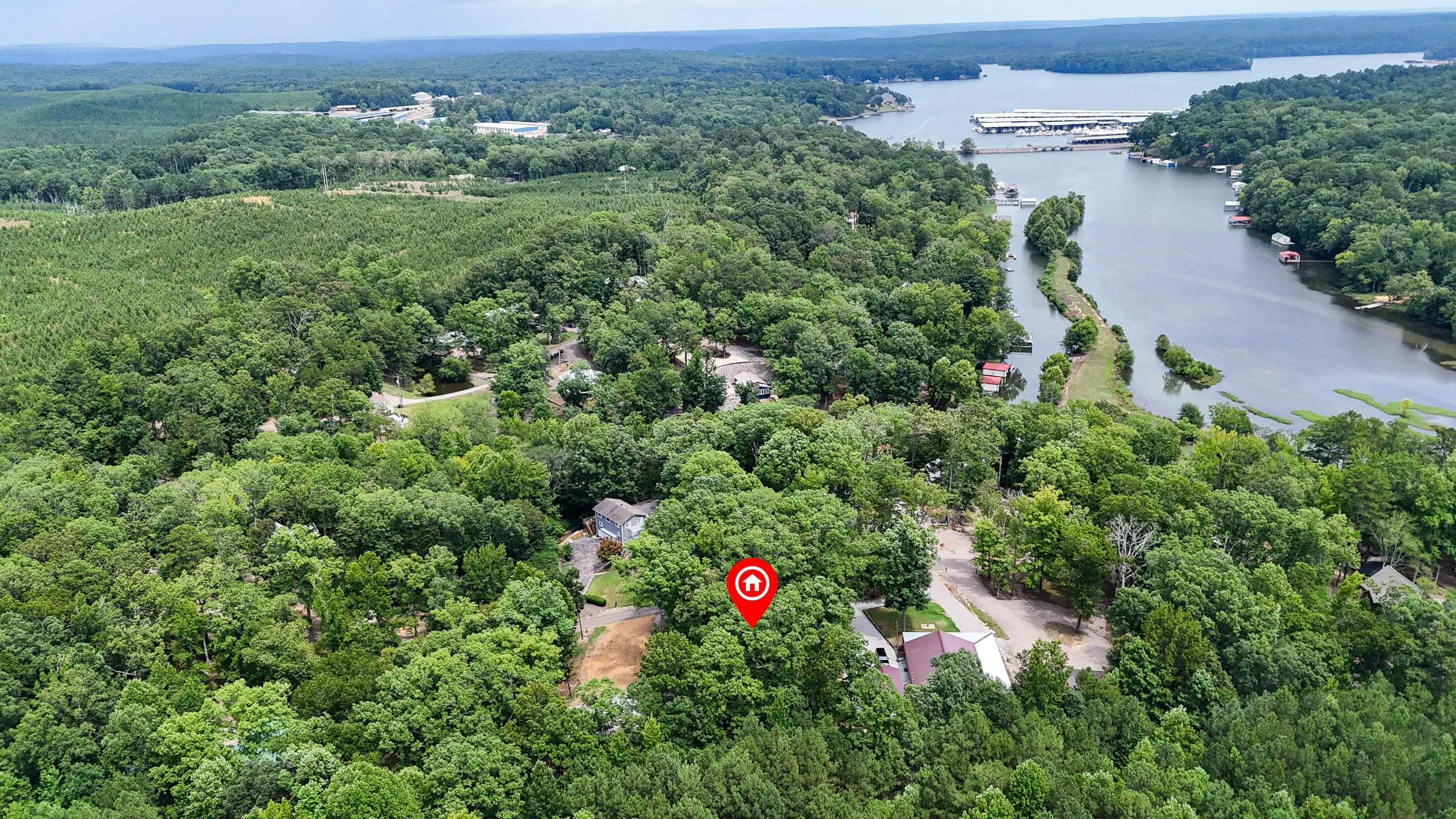 Birds eye view of property with a water view