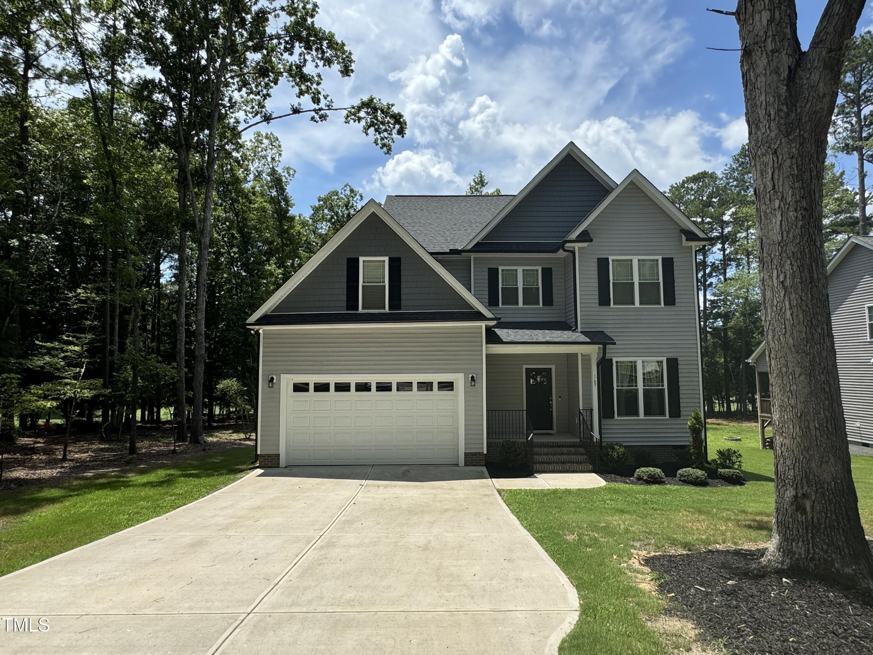 front view of a house with a yard