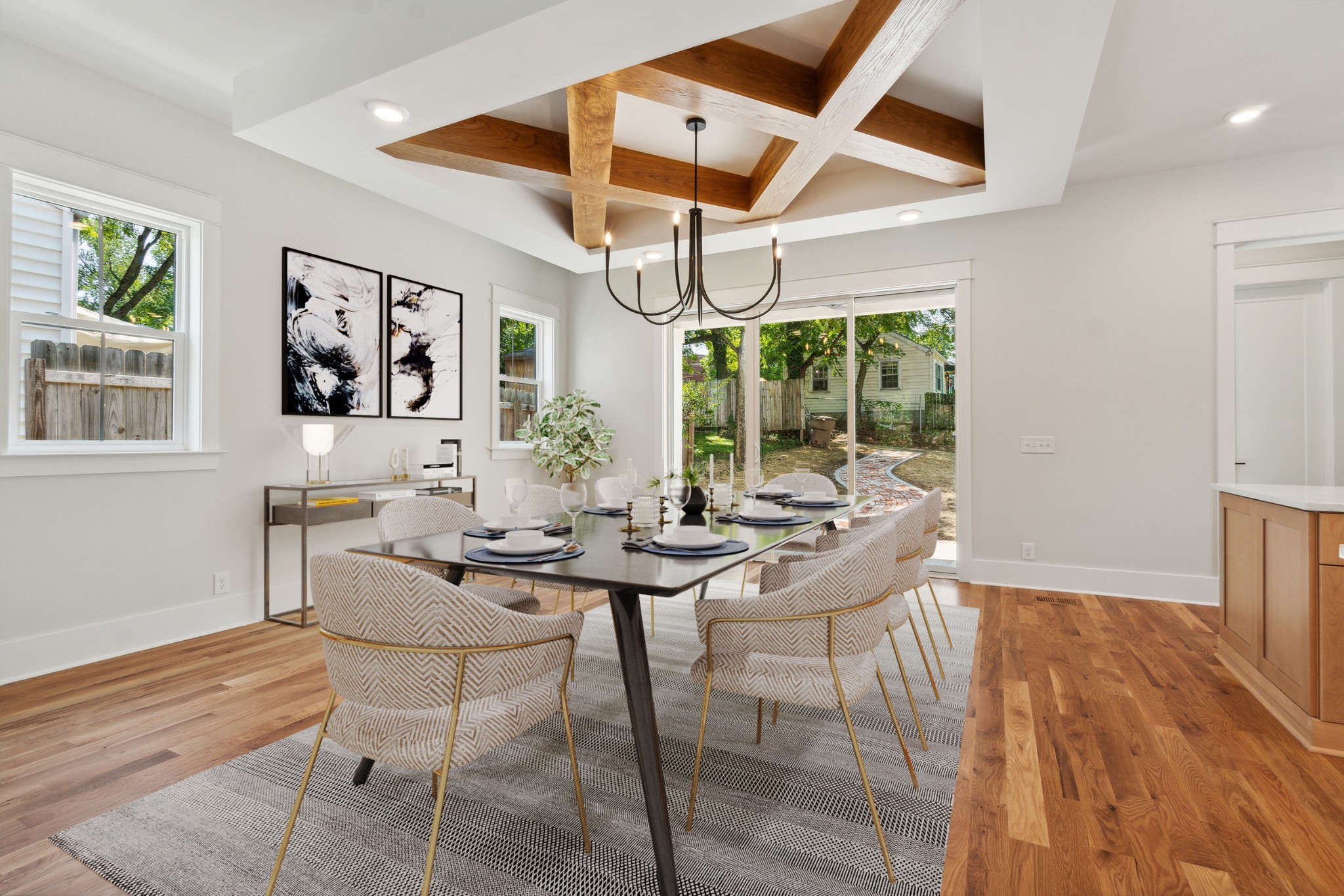 a view of a dining room with furniture wooden floor and a chandelier