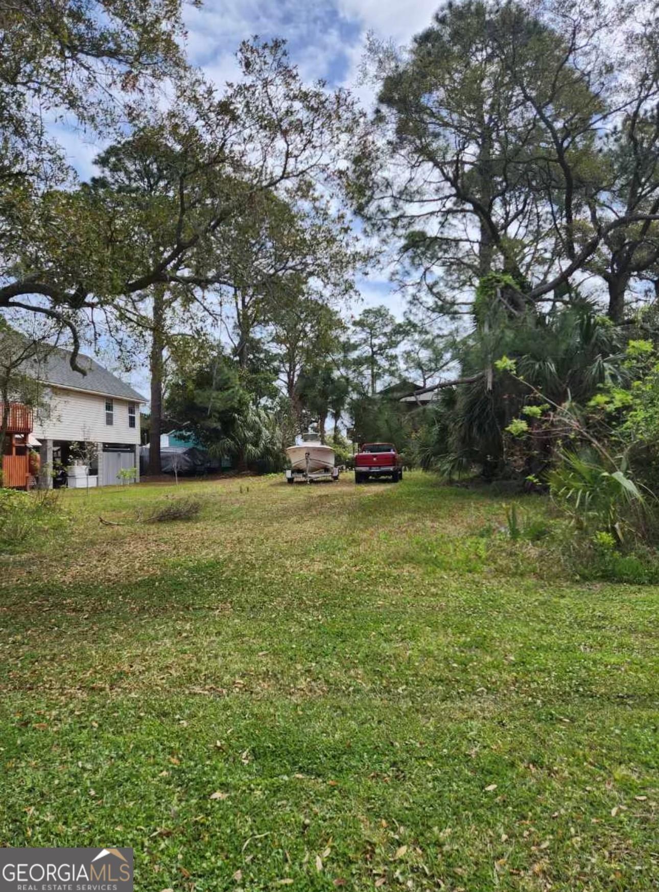 a view of outdoor space with deck and yard