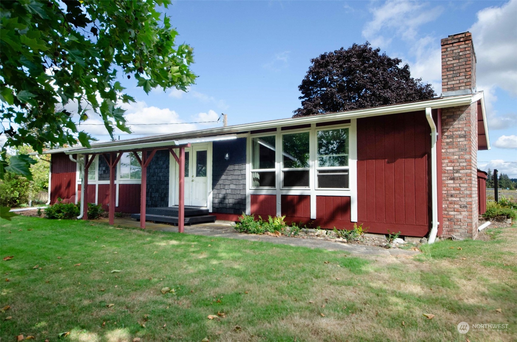 front view of a house with a yard