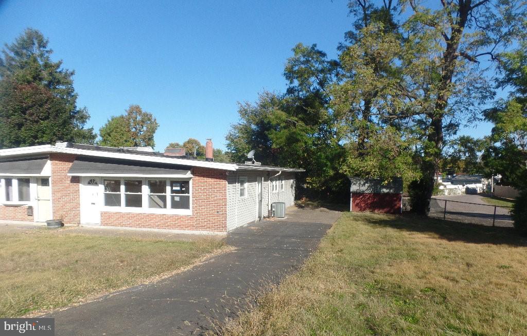 a view of a house with a yard and garage