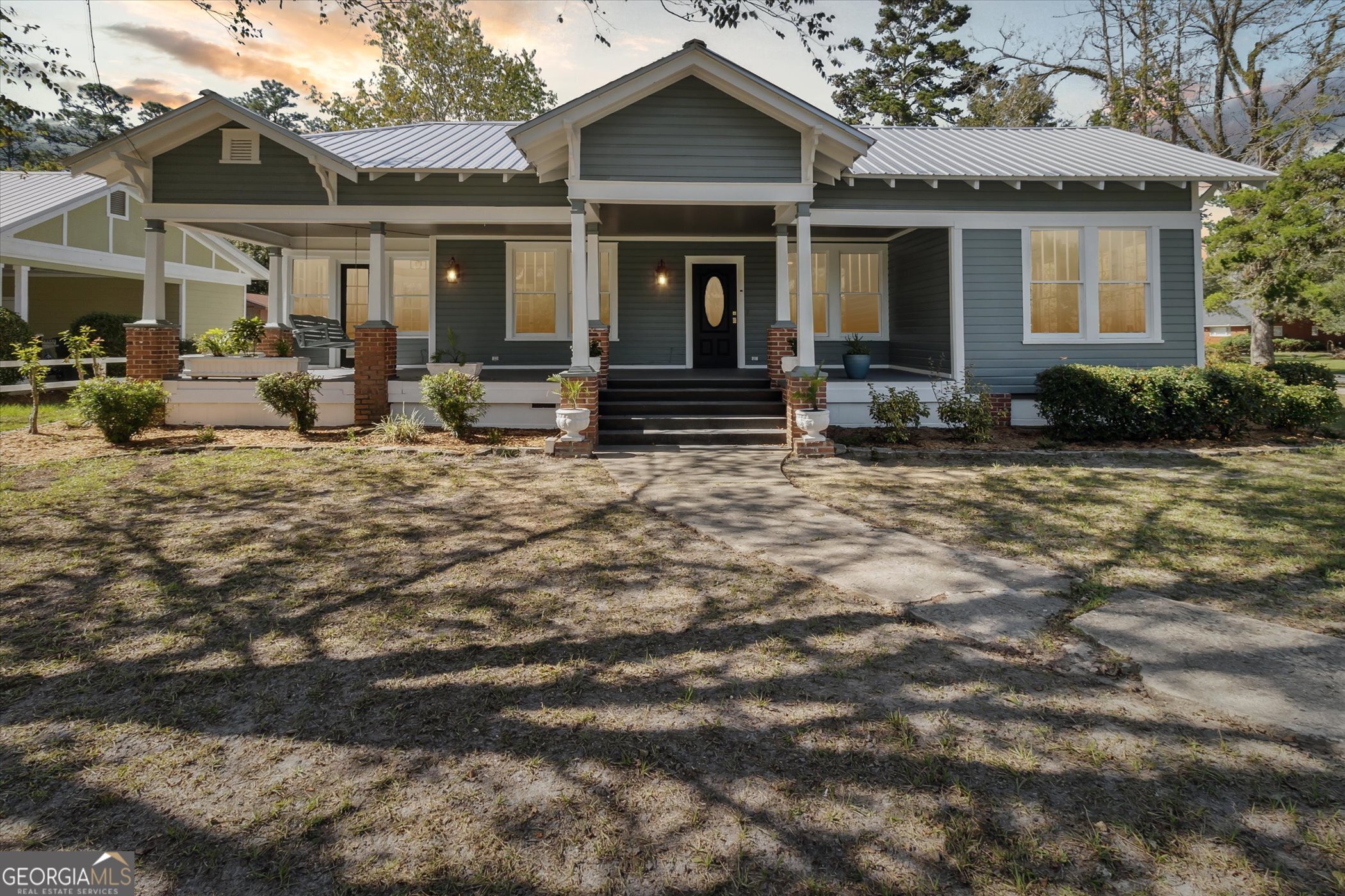 a front view of a house with garden