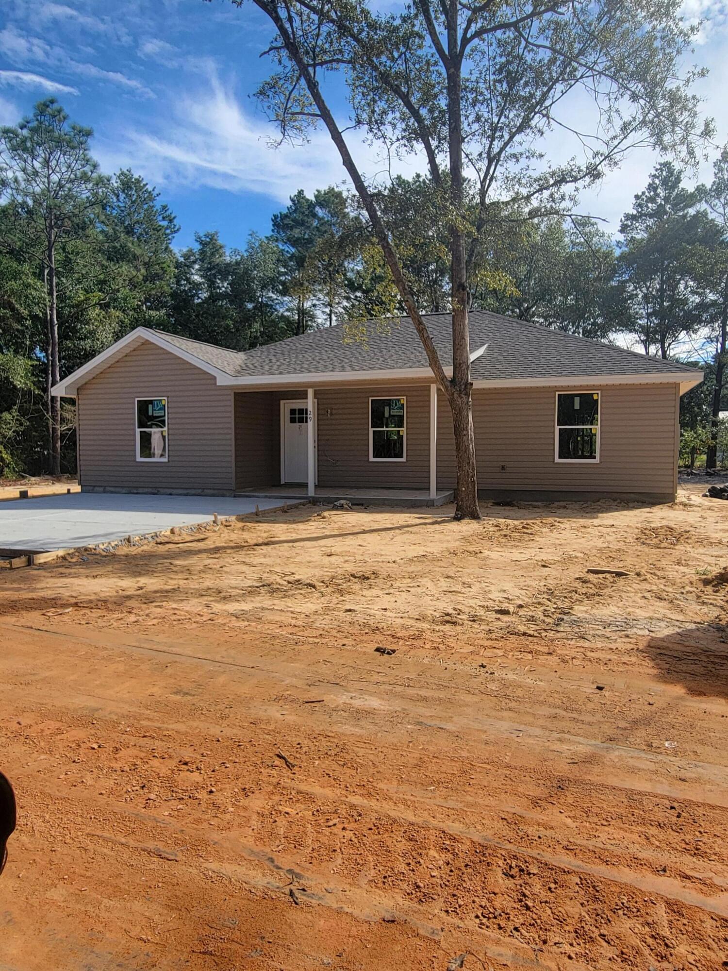 a house with a large tree in front of it