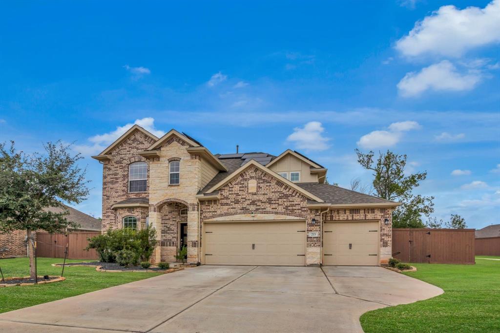 Front of the property with 3 car garage