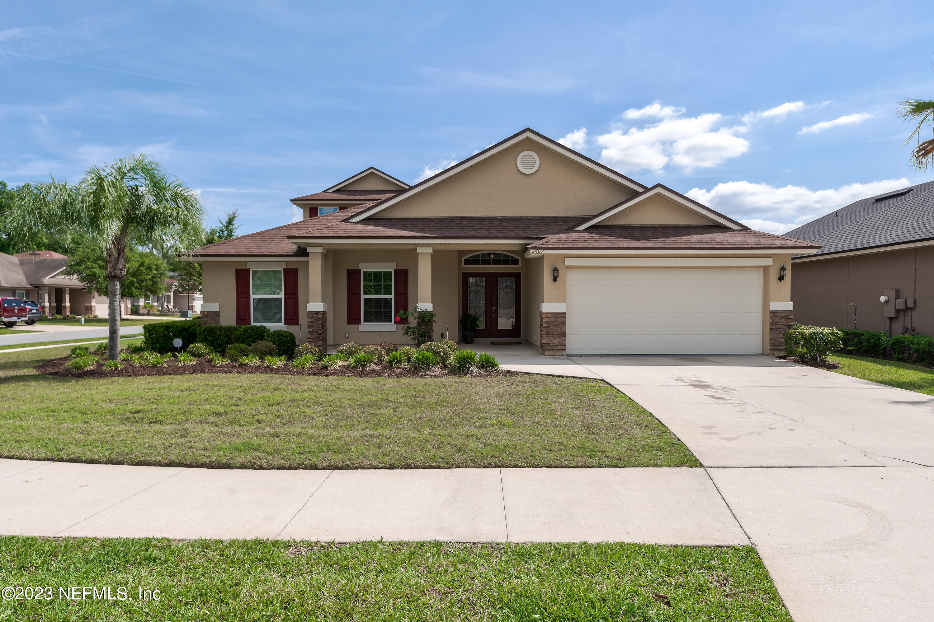 a front view of a house with a yard