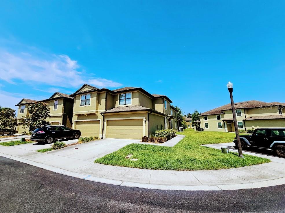 a front view of a house with a yard