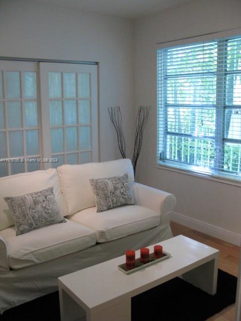 a living room with furniture and a window