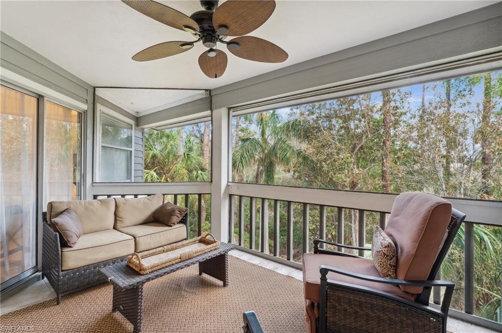 Sunroom featuring ceiling fan