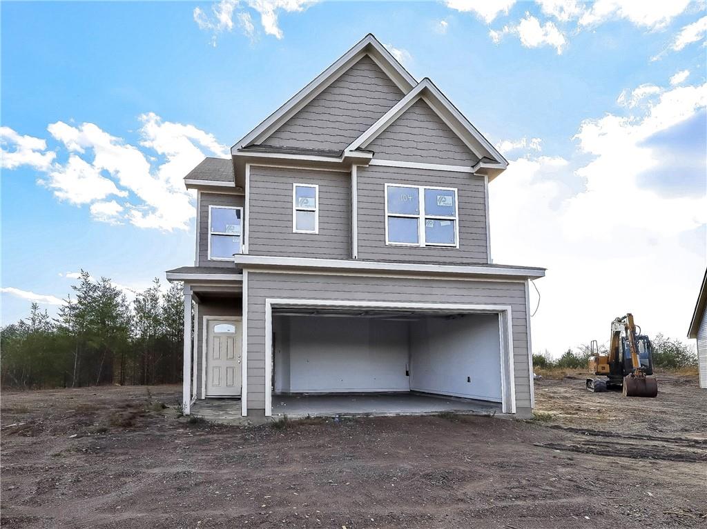 a front view of a house with a garage