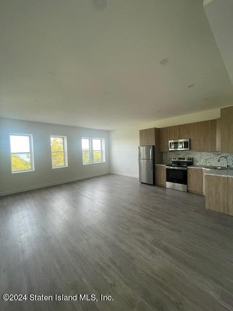 a view of a kitchen with a sink cabinets and a window