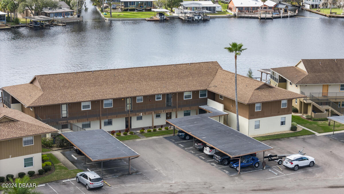 a aerial view of a house with swimming pool and sitting space