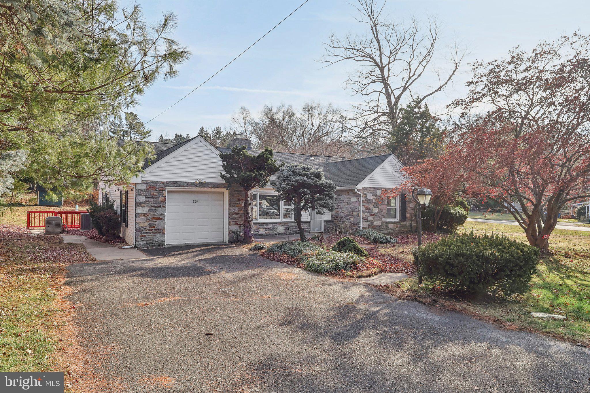 a view of a house with a yard and garage