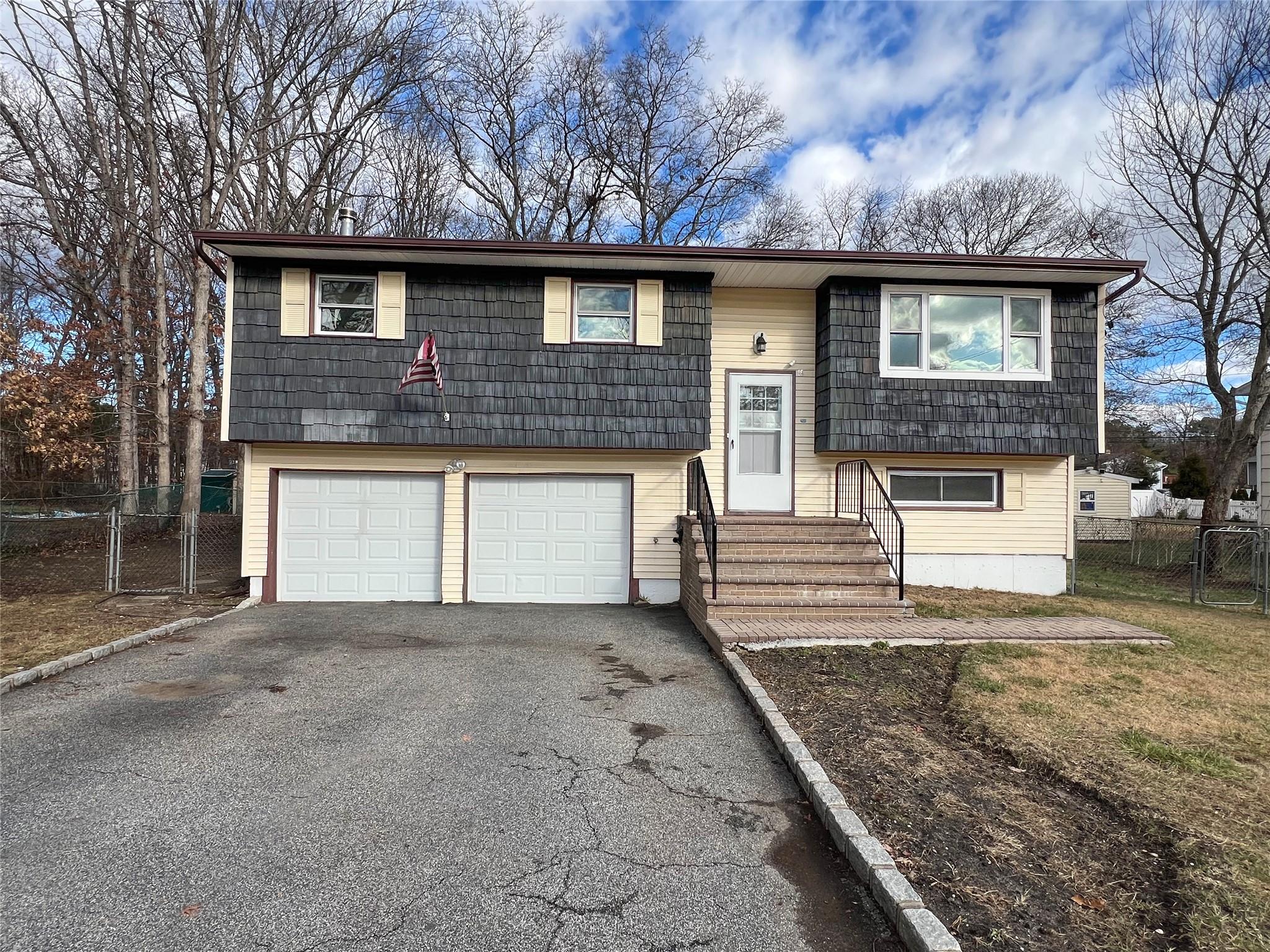 a front view of a house with garage