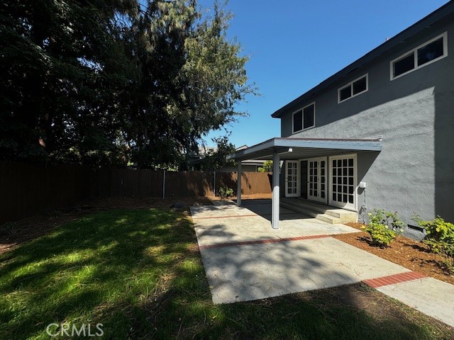 a view of house with backyard space and garden