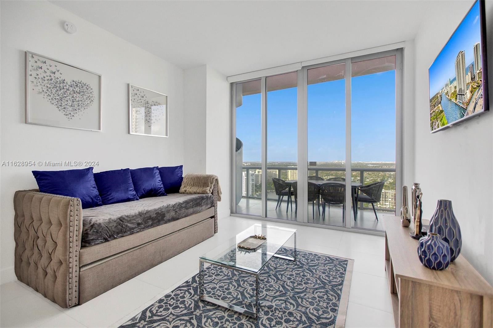 a living room with furniture and a rug