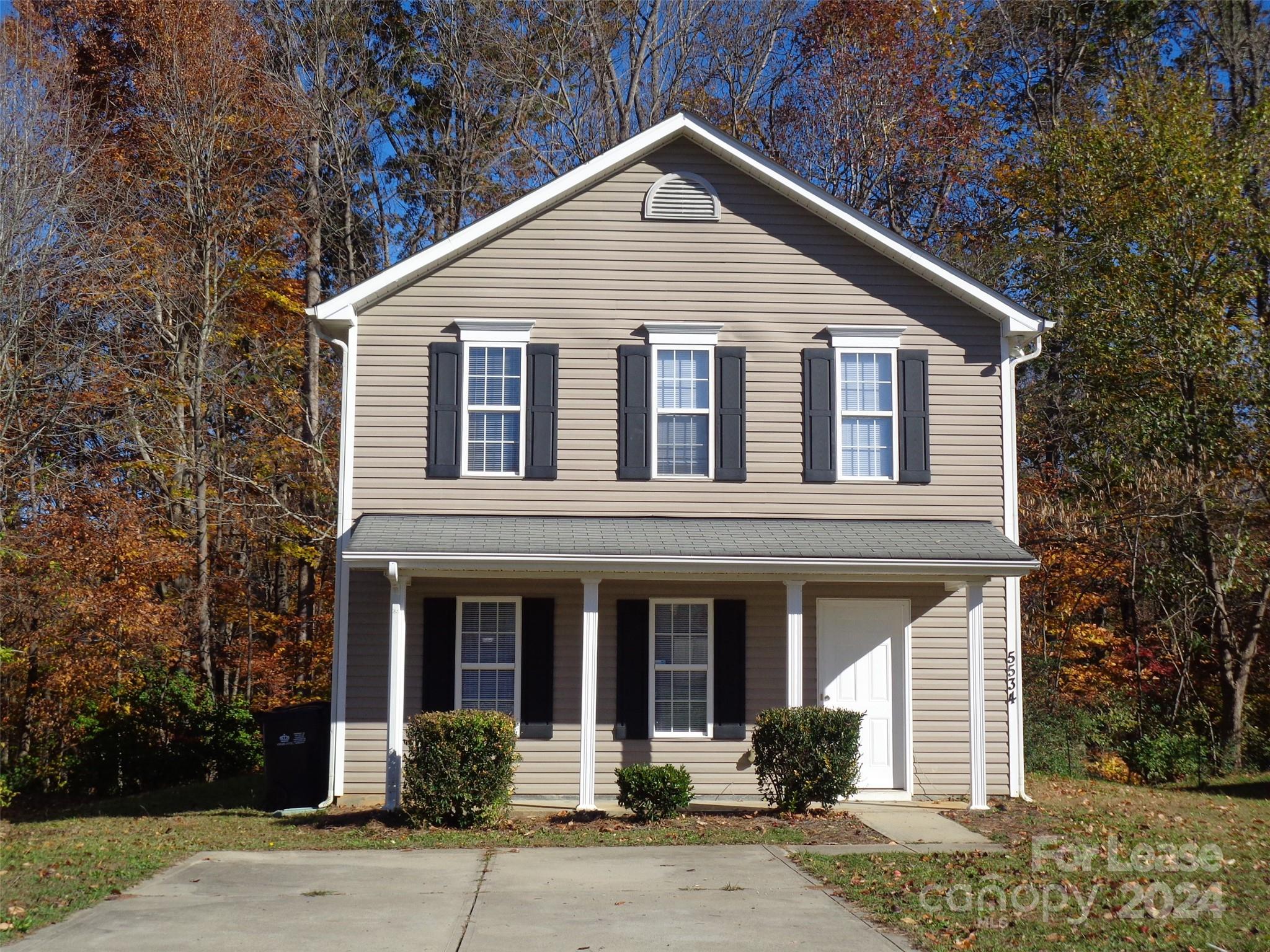 a front view of a house with garage