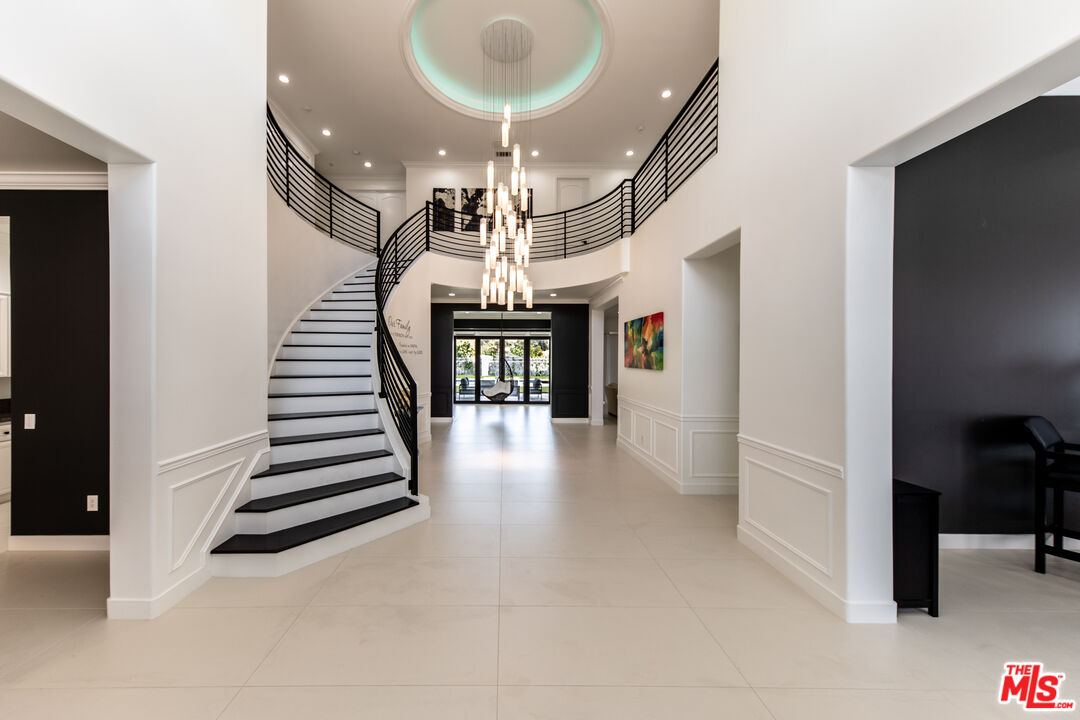 a view of entryway and hall with a front door