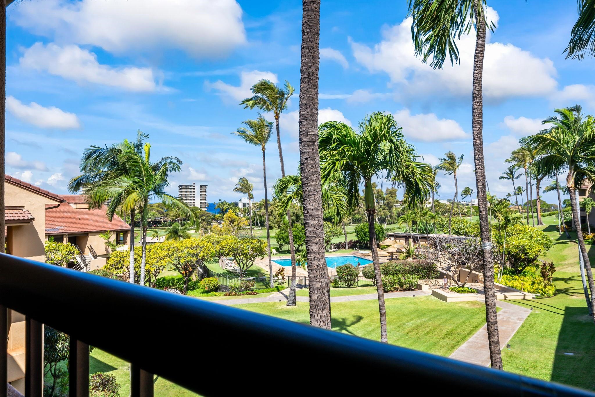 a view of swimming pool from a balcony