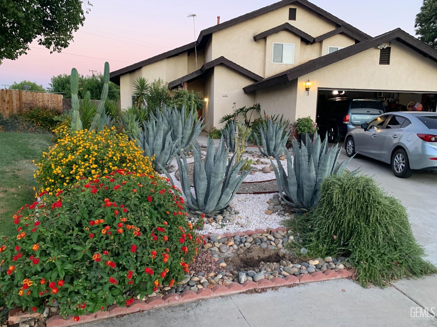 a front view of a house with garden