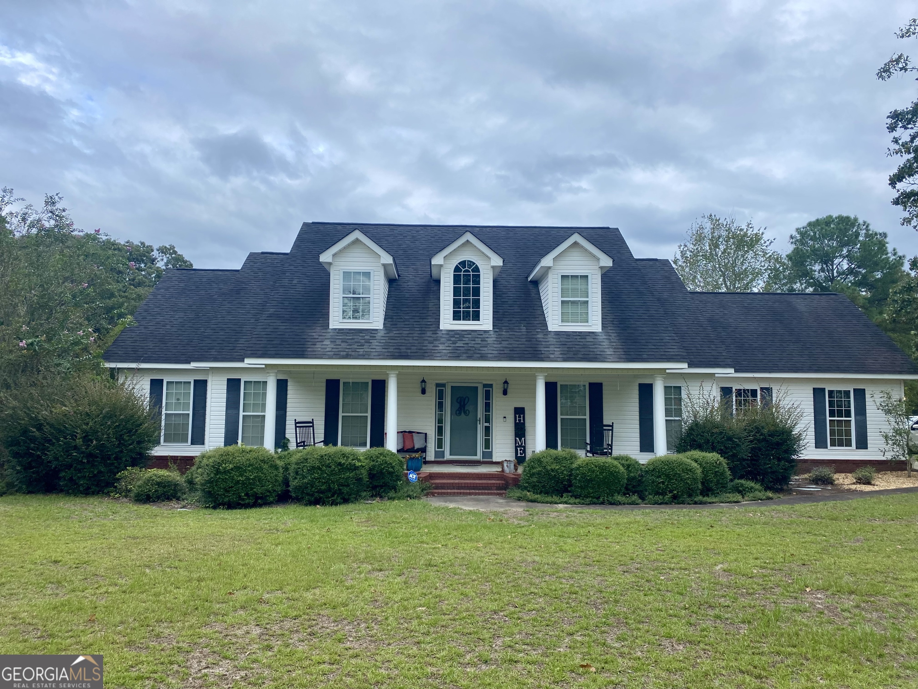 a front view of a house with a yard