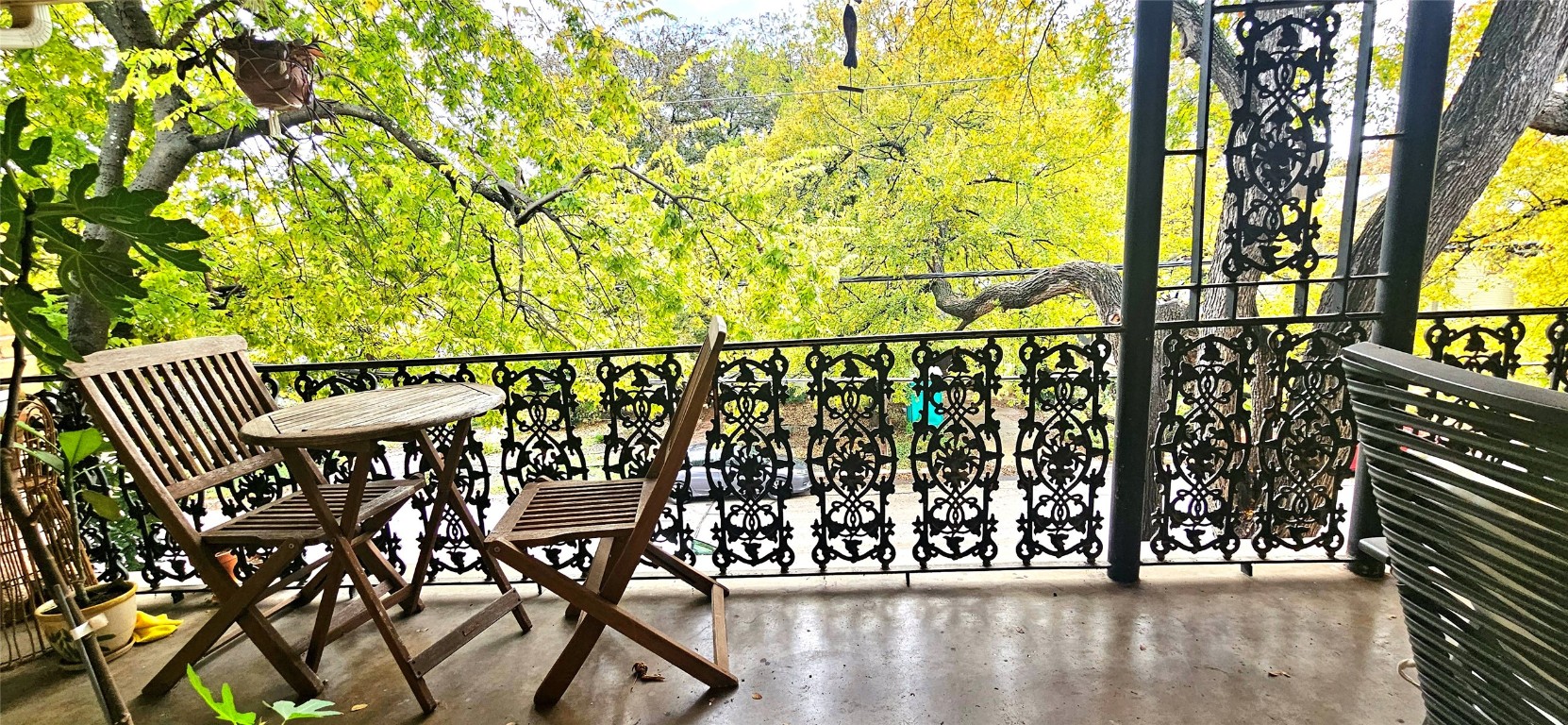 a view of wooden bench with wooden fence