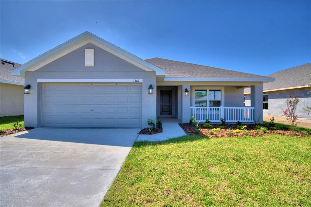 a front view of house with outdoor seating