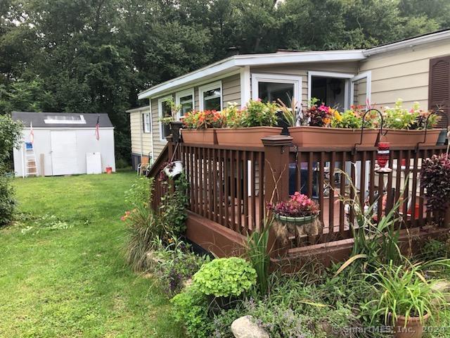 a front view of house with a garden