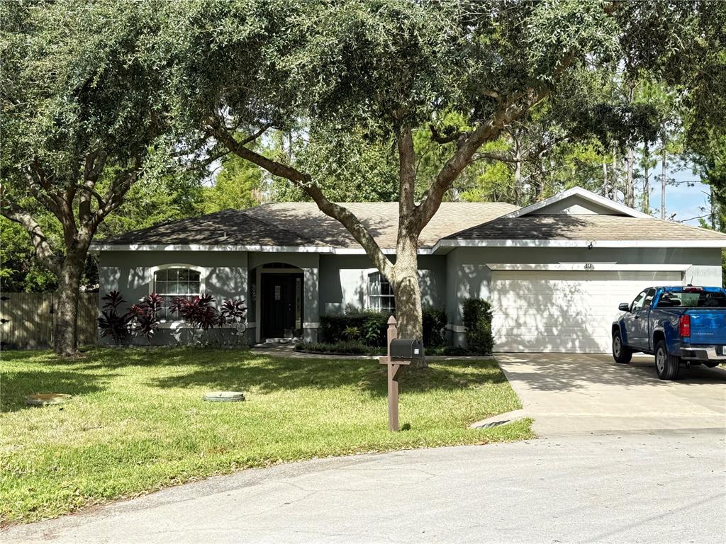 a view of a house with a yard porch and sitting area