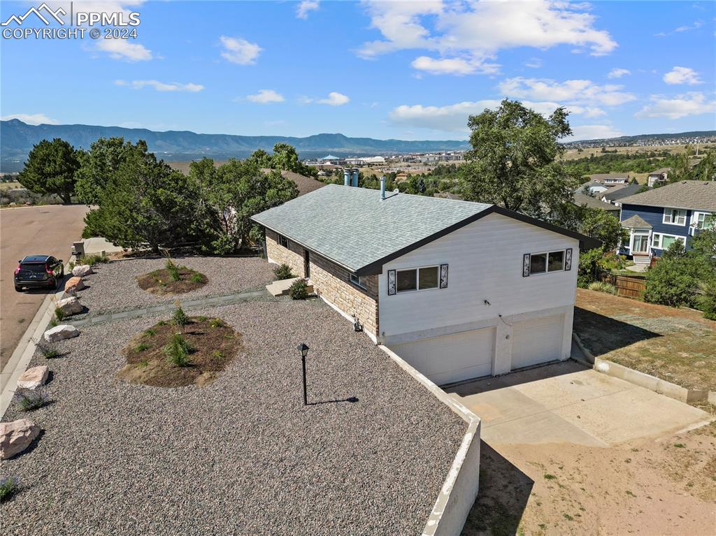 a aerial view of a house with a yard