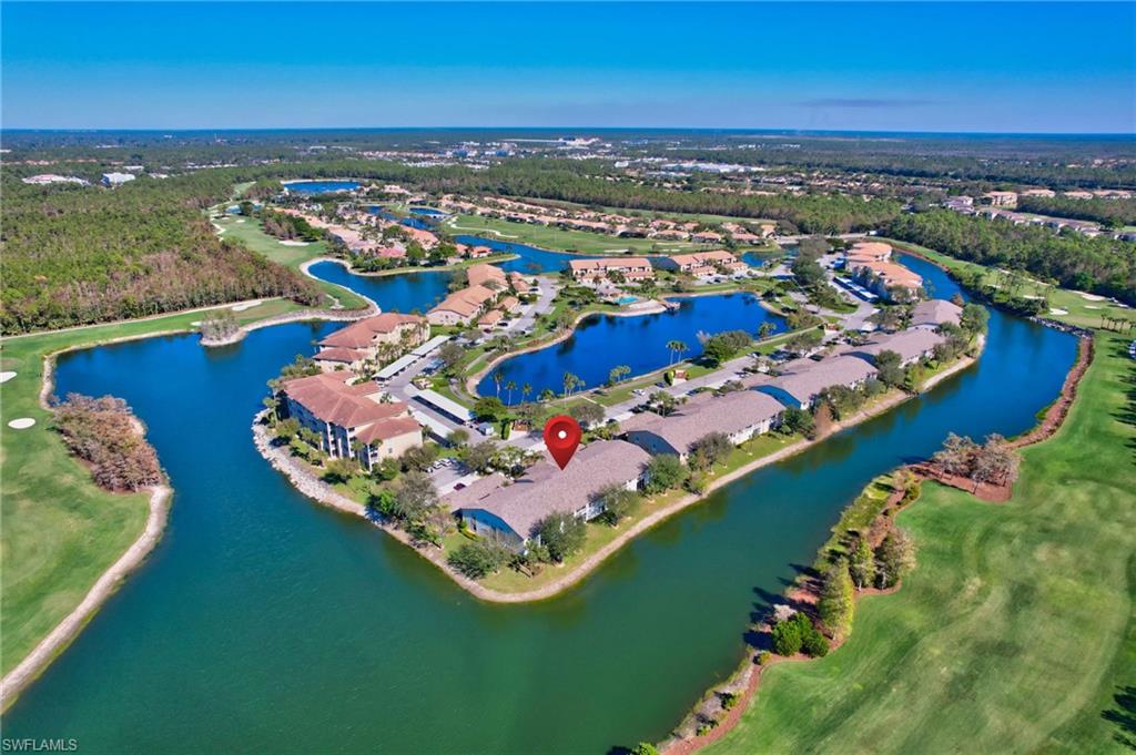 an aerial view of a house with a ocean view