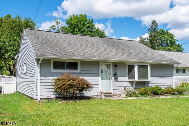 a view of front of house with a yard