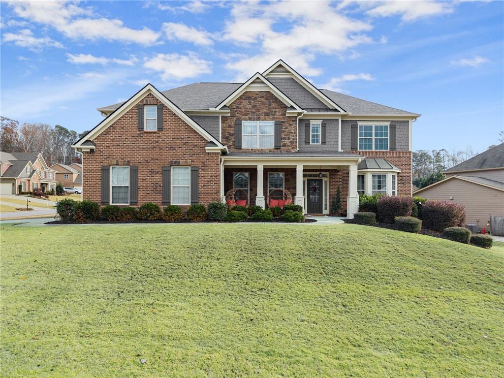 a front view of a house with a yard