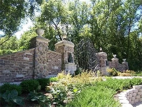 a view of a house with large trees