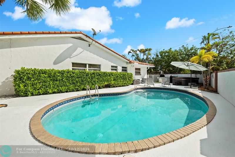 a view of a swimming pool with a garden