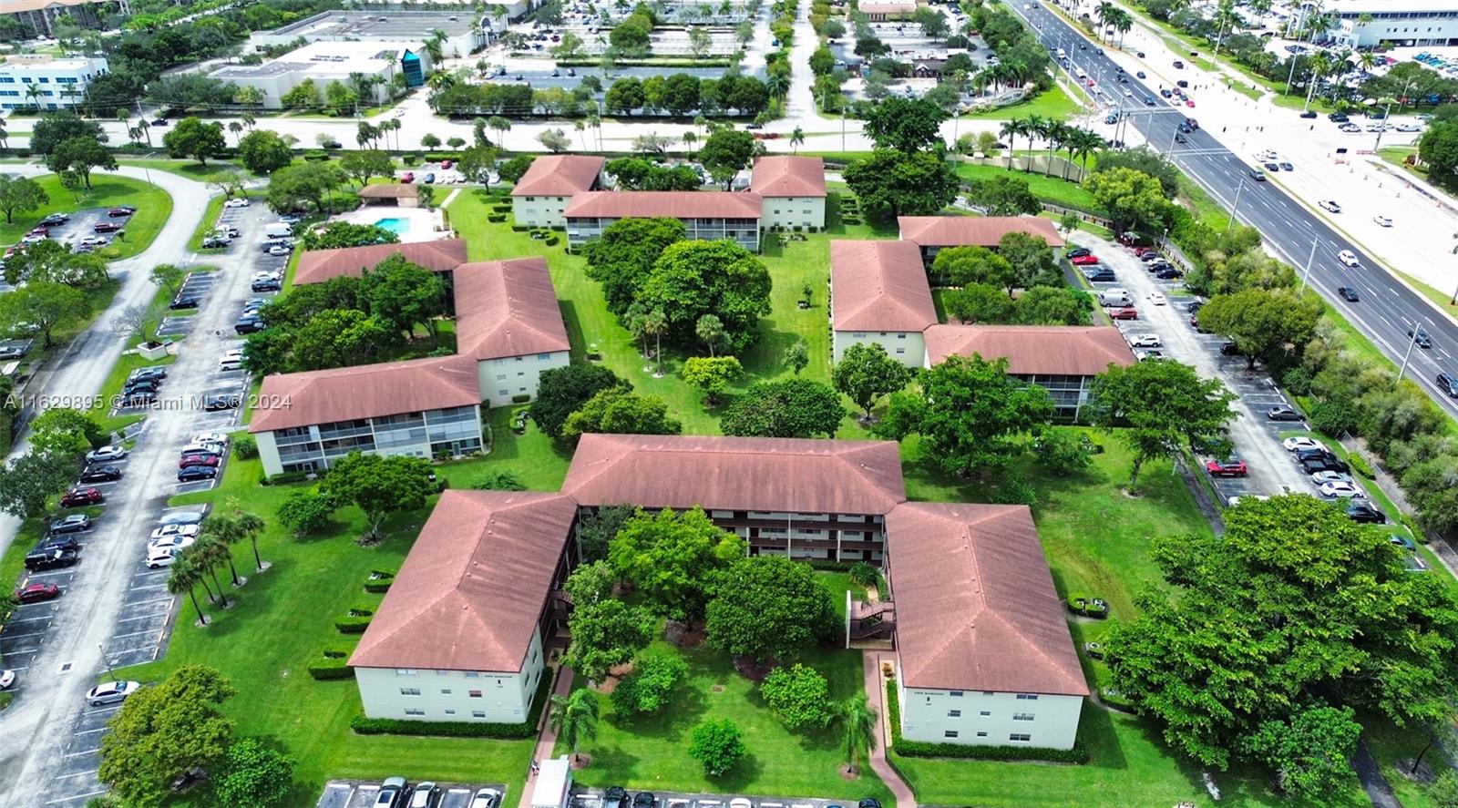 an aerial view of residential houses with yard