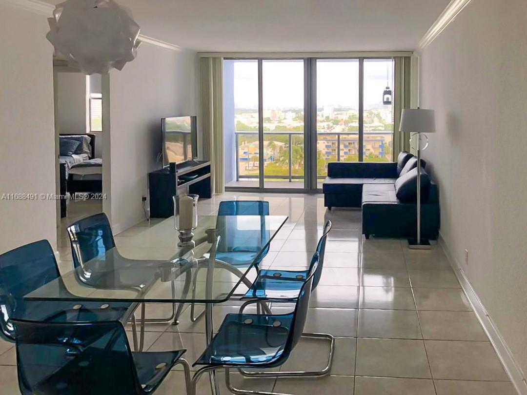 a view of a dining room with furniture window and outside view