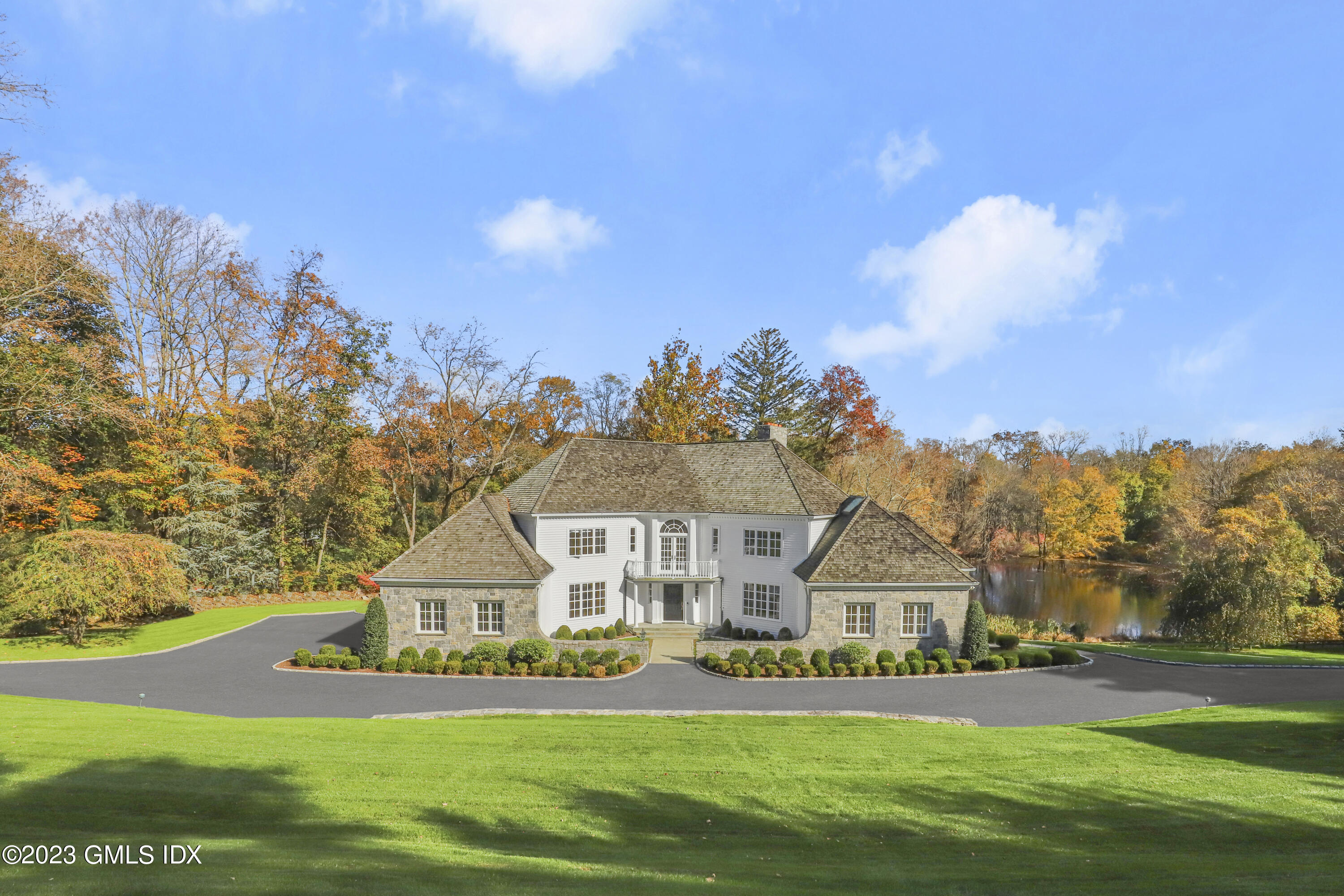 a front view of house with yard and green space