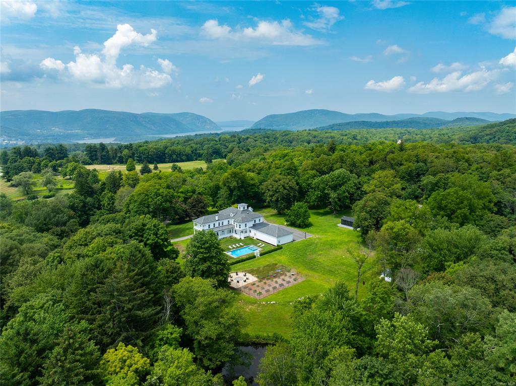 Birds eye view of property with a mountain view