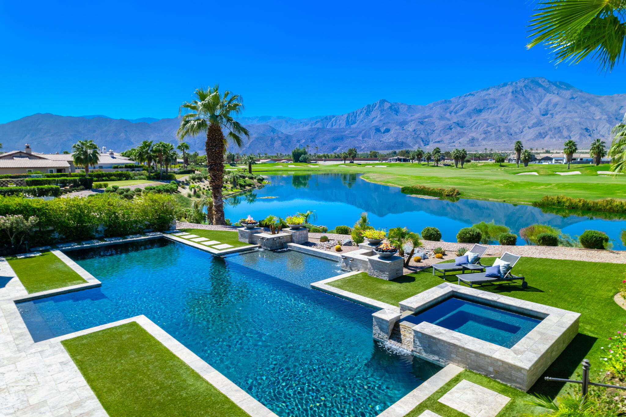 a view of swimming pool outdoor seating and lake view