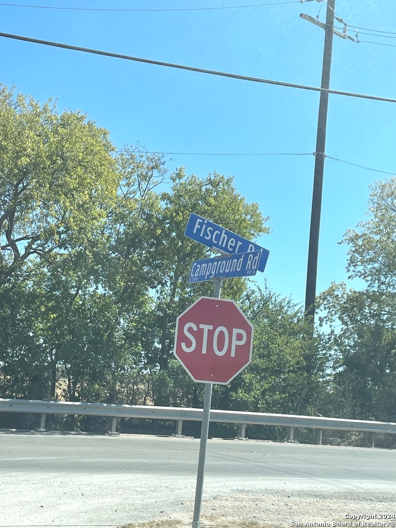 a sign that is on a pole on a road