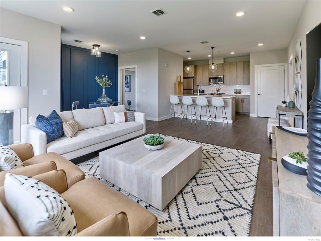 Living room featuring sink and dark hardwood / wood-style floors