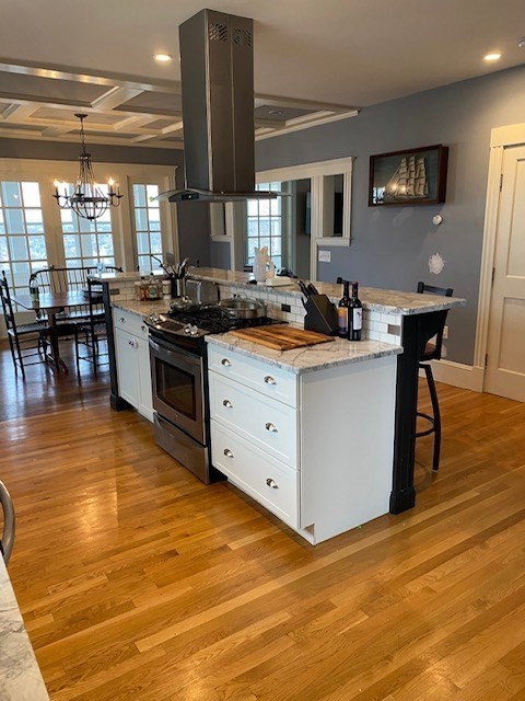 a kitchen with stainless steel appliances granite countertop a stove and a sink