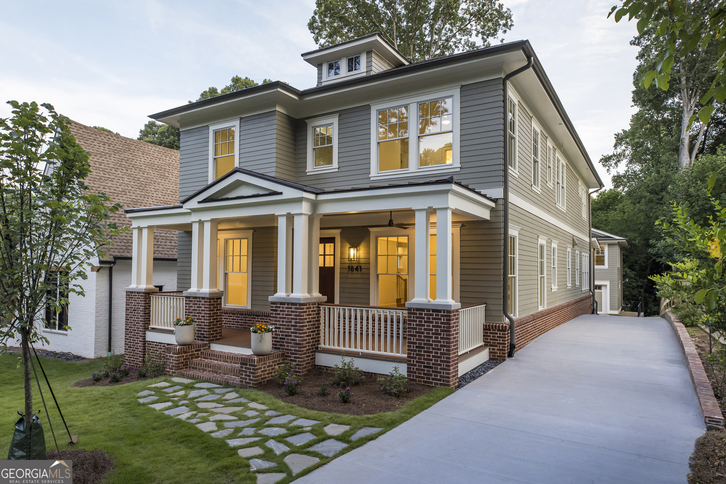 a front view of a house with a yard outdoor seating and yard