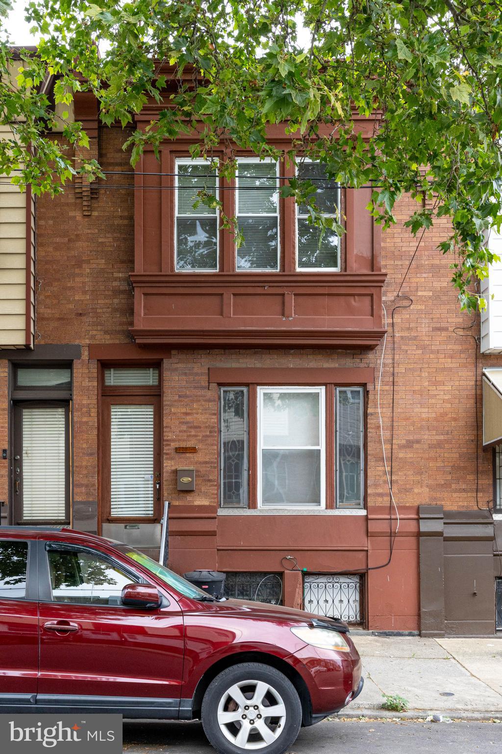 a front view of a house with parking space